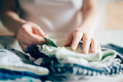 Folding up dry laundry.